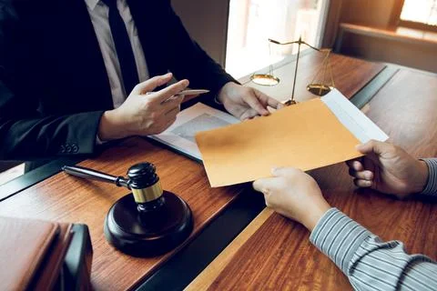 Client is submitting information on the paper of the prosecution document t.. Stock Photos