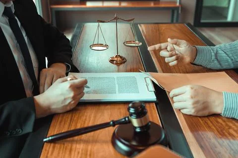 Client is submitting information on the paper of the prosecution document t.. Stock Photos