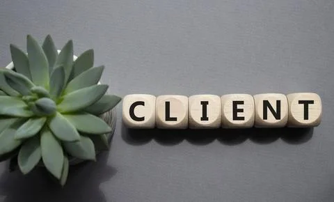 Client symbol. Concept word Client on wooden cubes. Beautiful grey backgrou.. Foto stock