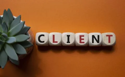 Client symbol. Concept word Client on wooden cubes. Beautiful orange backgr.. Foto stock