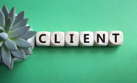 Client symbol. Concept word Client on wooden cubes. Beautiful green backgro.. 库存照片