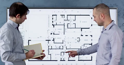 Client tells about flat requests while engineer takes notes Stockbeeldmateriaal 243828972