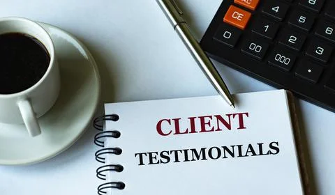 CLIENT TESTIMONIALS - words written in a notebook against the background of a Stock Photos