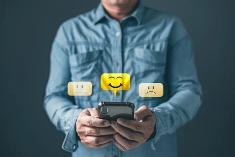 A client use smartphone select on the five star to give satisfaction in ser.. Stock Photos