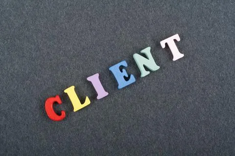 CLIENT word on black board background composed from colorful abc alphabet b.. Foto stock