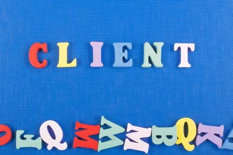 CLIENT word on blue background composed from colorful abc alphabet block wo.. 库存照片