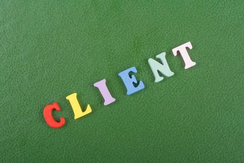 CLIENT word on green background composed from colorful abc alphabet block w.. Foto stock