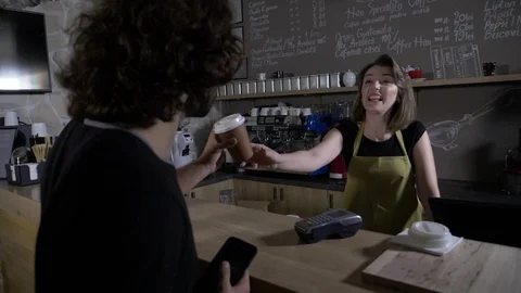 Clients waiting in line in a modern cafe shop to be served and pay with a new Stock Footage 86505076