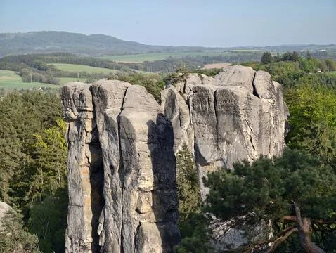 Cliff above trees. Dramatic sandstone precipice with rugged textures and di.. Photos