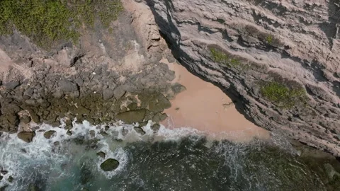 Cliff aerial top down view of a rocky coastline in Uluwatu, Bali. Stock Footage 253422276