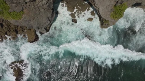 Cliff aerial top down view of a rocky coastline in Uluwatu, Bali. Stock Footage 253422517