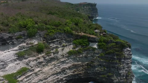 Cliff aerial top down view of a rocky coastline in Uluwatu, Bali. Stock Footage 253501306
