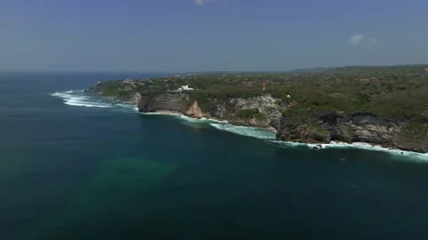 Cliff aerial top down view of a rocky coastline in Uluwatu, Bali. Stock Footage 253501397