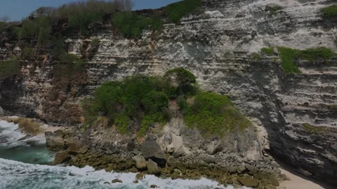 Cliff aerial top down view of a rocky coastline in Uluwatu, Bali. Stock Footage 253534921