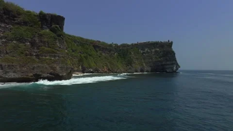 Cliff aerial top down view of a rocky coastline in Uluwatu, Bali. Stock-Footage 253704903