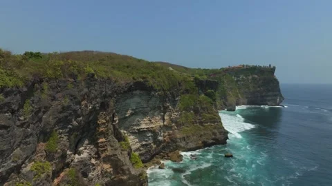 Cliff aerial top down view of a rocky coastline in Uluwatu, Bali. Stock Footage 253774914
