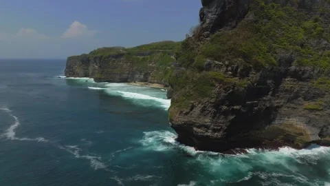 Cliff aerial top down view of a rocky coastline in Uluwatu, Bali. Stock Footage 253774969