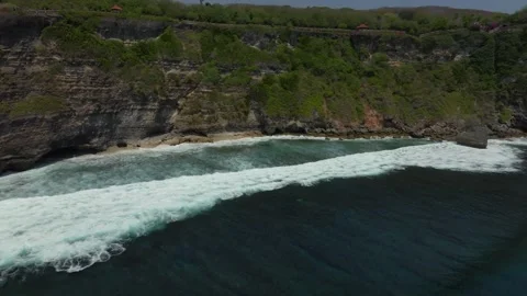Cliff aerial top down view of a rocky coastline in Uluwatu, Bali. Stock Footage 255686954
