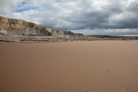 Cliff and beach Stock Photos