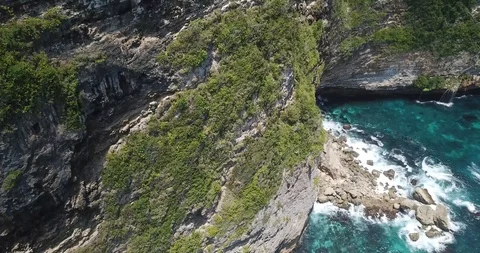 Cliff and Waves Drone Shot Stock Footage 106787200