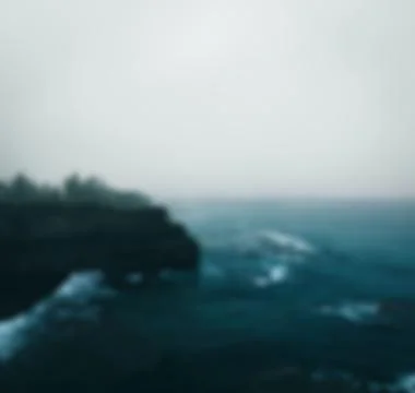 Cliff on beach blurred 写真素材