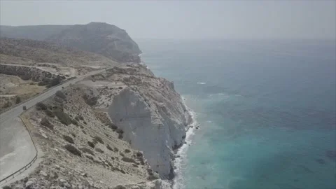 A cliff beyond which the sea is visible. Stock Footage 149109015