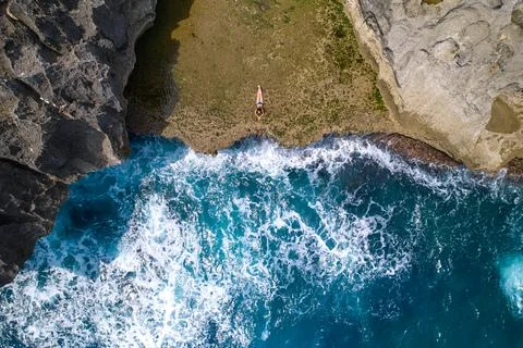 A cliff broken by an ocean wave. The cliff is washed by powerful waves of the Stock Photos