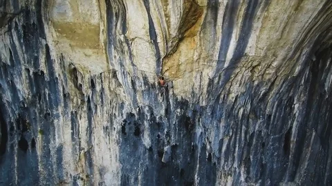 Cliff climber young man on vertical wall, Prohodna Cave, Bulgaria Stock Footage 88211571