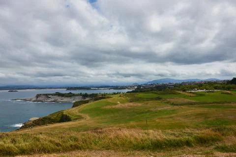 A cliff with clouds Stock Photos