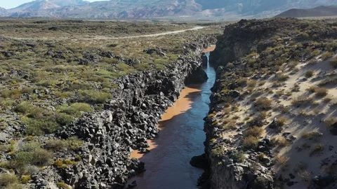 Cliff created by river that flows through the desert Stock Footage 255862182