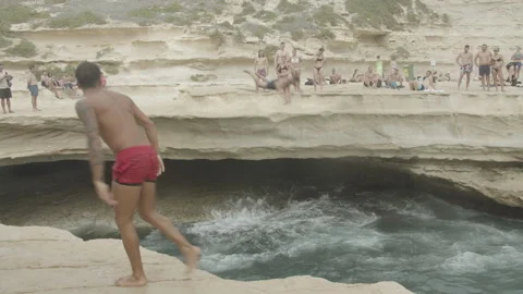 Cliff Dive into Sea1 1920x1080 Stock Footage 145359687