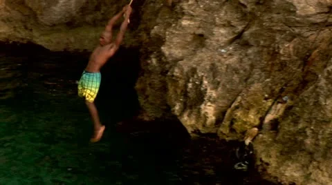 Cliff Diving with Rope Swing Stock Footage 22159324