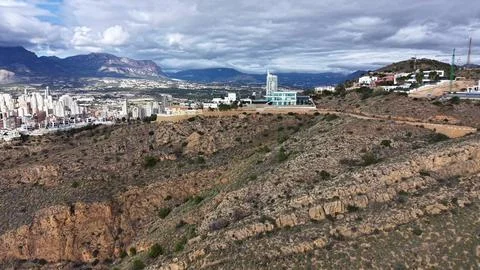 Cliff Edge With Scattered Modern Structures, Panoramic City View From Ridge Stock Photos