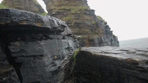 Cliff face rock formation in the rain Stock Footage 111568226