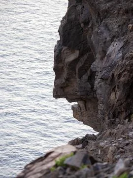 A cliff face in the shape of a human head in Playa Santiago on La Gomera, Can Stock Photos