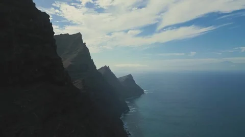 A cliff falling into the blue ocean. Dragon's Tail. Stock Footage 266253322