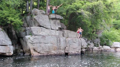 Cliff jump crazy backflip into water Stock Footage 46090537