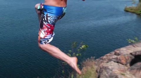Cliff jump running backflip into water (gainer) Stock Footage 27693873
