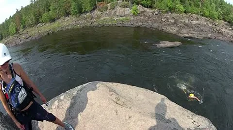 Cliff jump into water Stock Footage 20603716