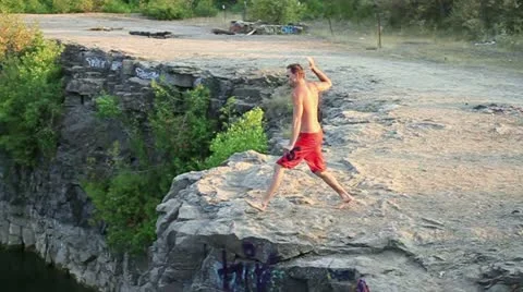 Cliff jumping double flip Stock Footage 11432466