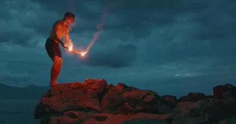 Cliff jumping, it's more extreme with fire Stock Footage 124730496