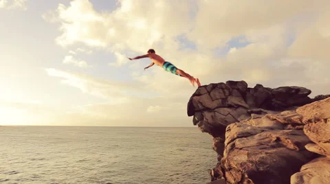 Cliff Jumping at Sunset. Summer Extreme Sports Cliff Jumping Outdoor Lifestyl Stock Footage 57222907