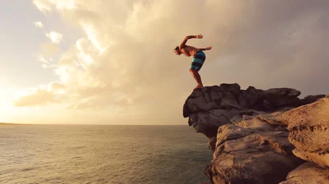 Cliff Jumping at Sunset. Summer Extreme Sports Cliff Jumping Outdoor Lifestyl Video stock 57222972