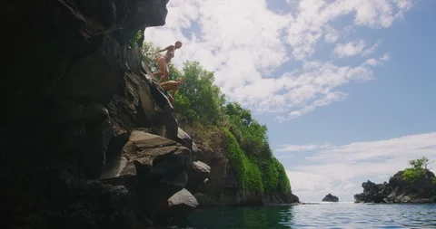 Cliff jumping together Stock Footage 108132379