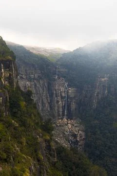 Cliff landscape with waterfall Stock Photos