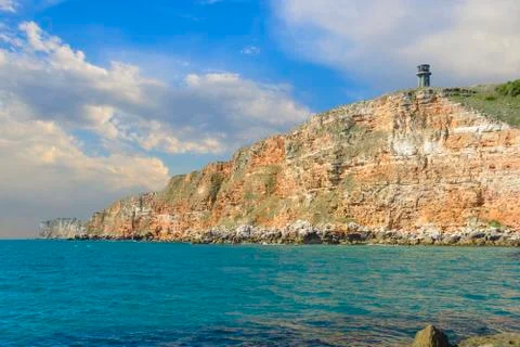 Cliff with lighthouse Stock Photos