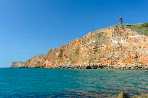 Cliff with lighthouse Stock Photos