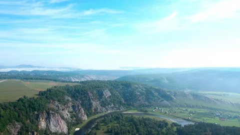 Cliff mountain area, a river flows downhill in the gorge. 스톡 동영상 114871580