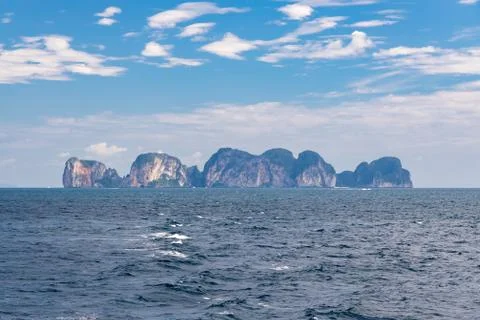 Cliff mountains of Phi Phi in distance. Stock Photos