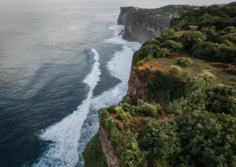 A cliff next to the ocean in Bali Stock Photos
